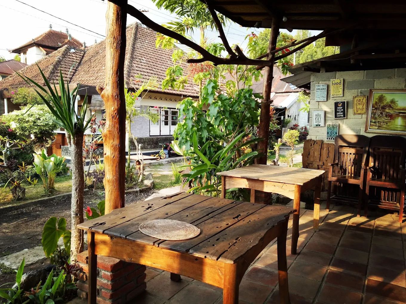 Open garden pavilion with reclaimed-wood tables