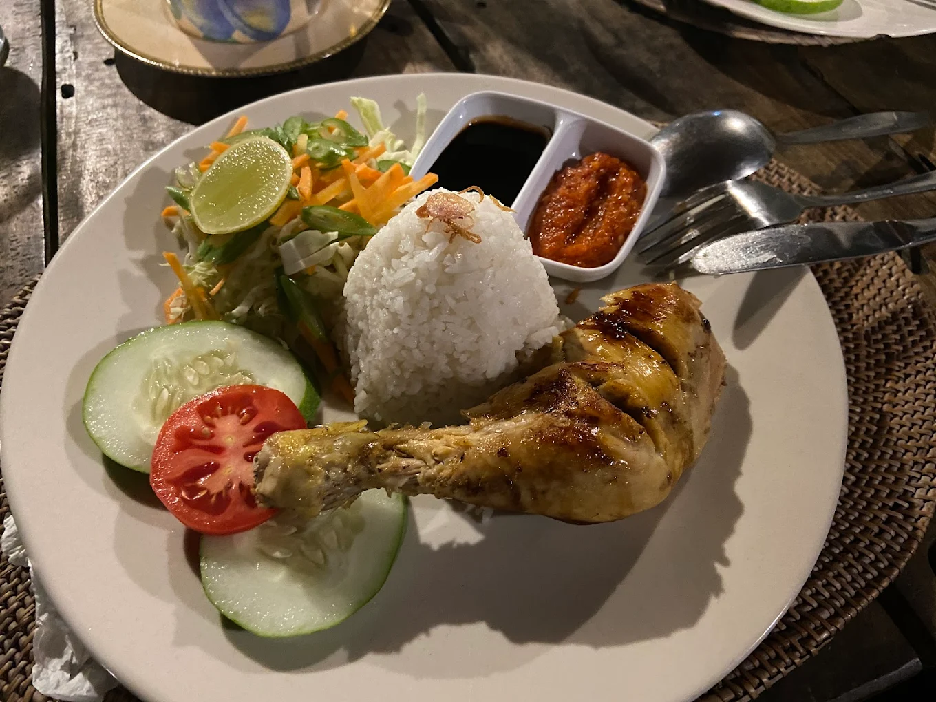 Plate of Balinese grilled chicken with rice and sambal