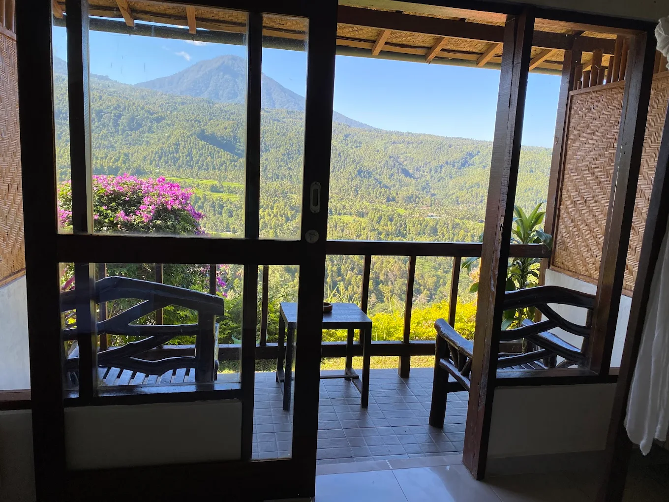 View through sliding doors to a balcony and volcano
