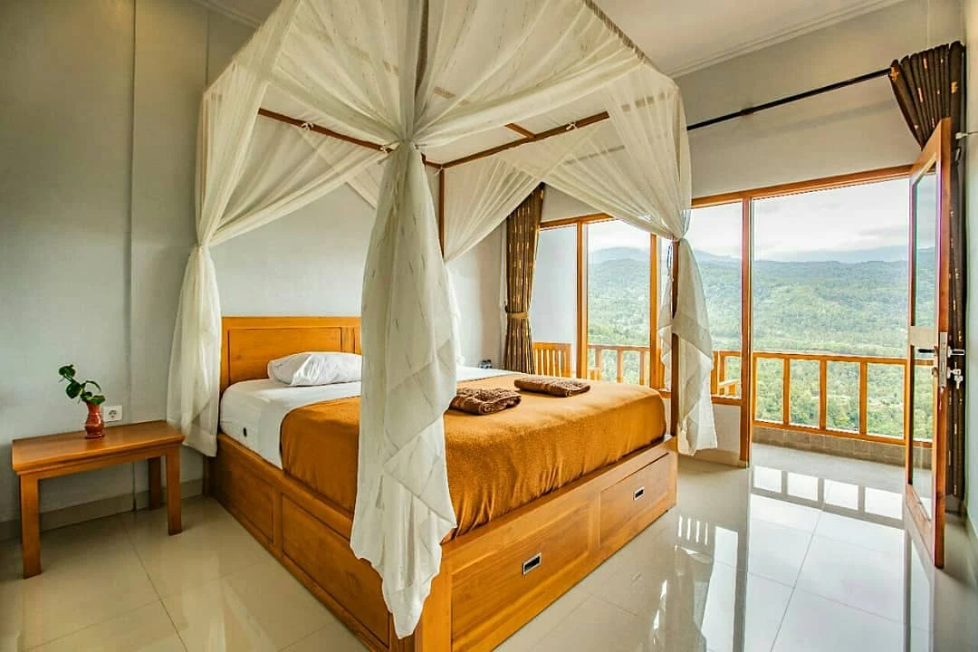 Master canopy room with floor-to-ceiling windows and valley view